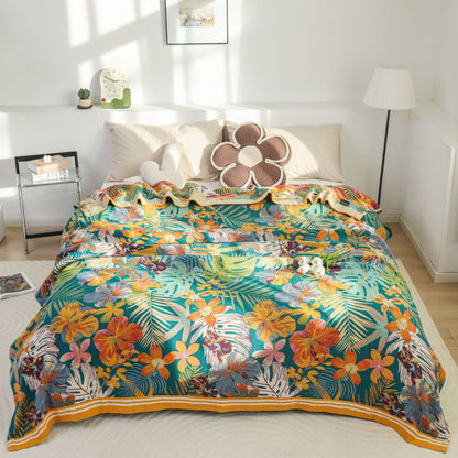 Coperta in garza di cotone con motivo a fiori e foglie vivaci