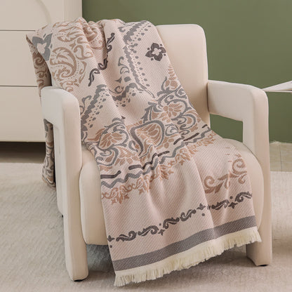 Trapunta leggera in garza di cotone con motivo paisley e nappe