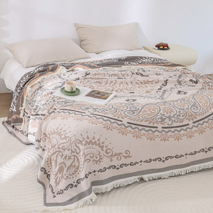 Coperta in garza di cotone leggera con motivo Paisley e nappa