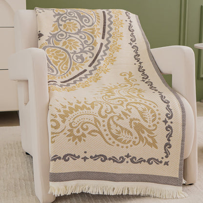 Trapunta leggera in garza di cotone con motivo paisley e nappe