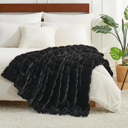 Coperta a righe in peluche tinta unita