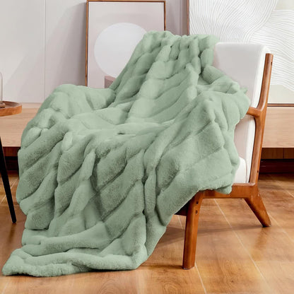 Coperta a righe in peluche tinta unita