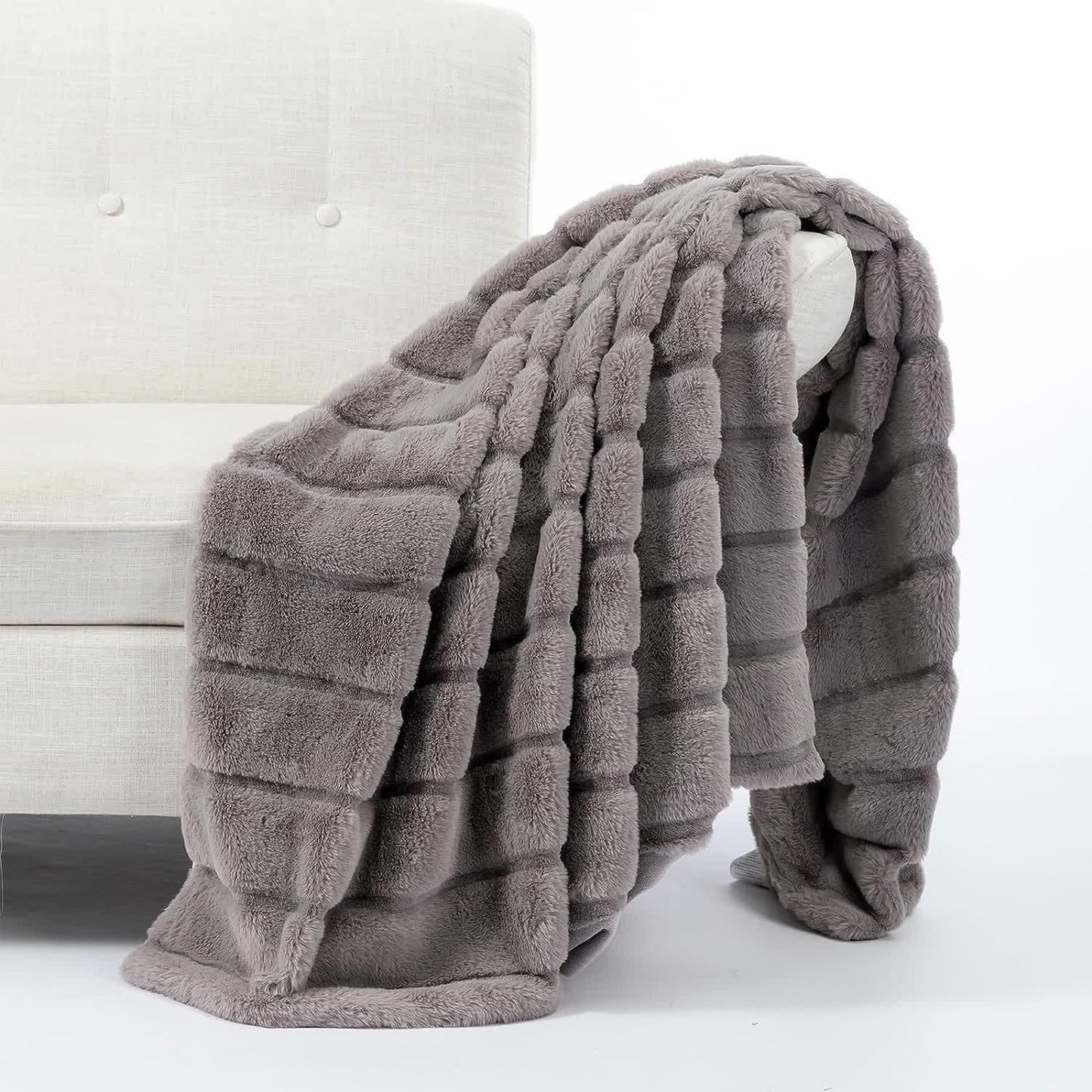 Coperta a righe in peluche tinta unita