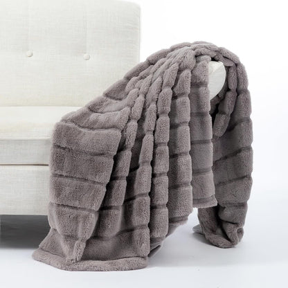 Coperta a righe in peluche tinta unita