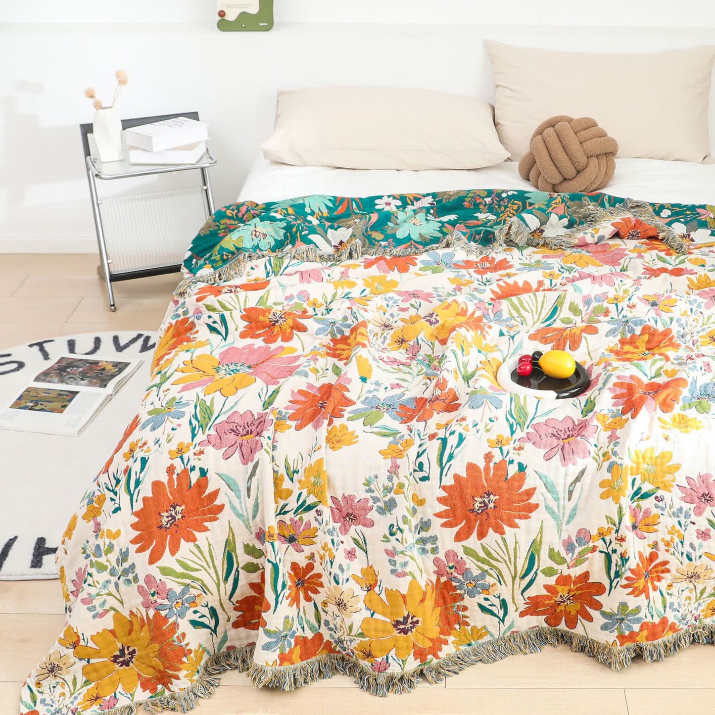 Coperta reversibile in garza di cotone con nappa floreale brillante