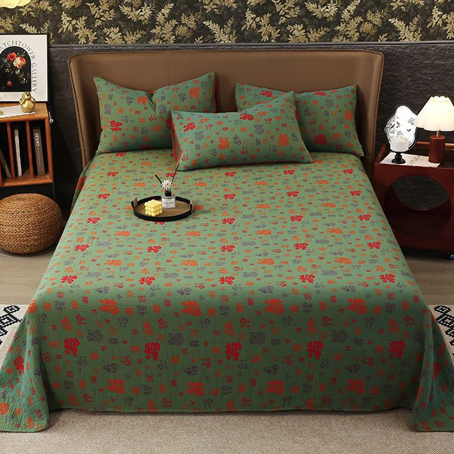 Copriletto in garza di cotone jacquard tinto in filo
