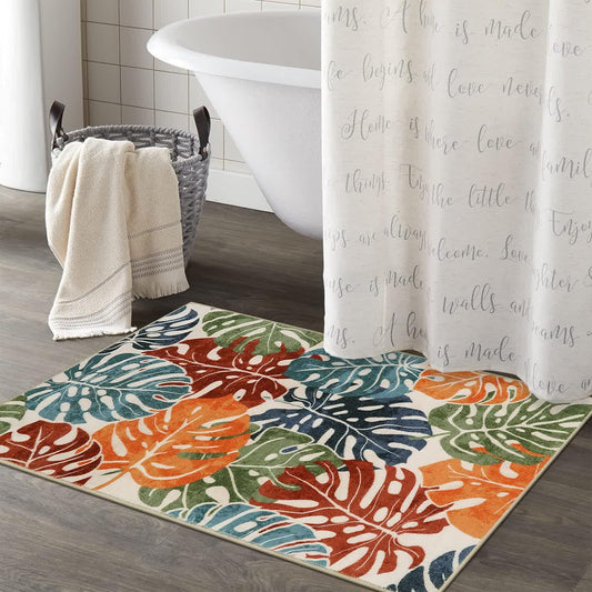 Tappeto con foglie e fiori di colore tropicale
