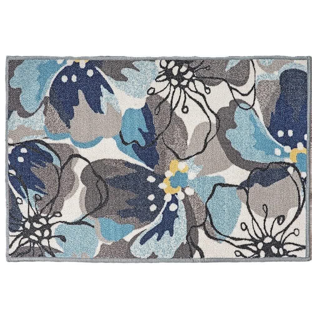Tappeto con foglie e fiori di colore tropicale
