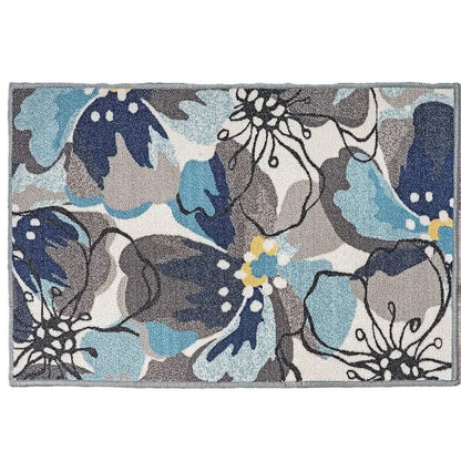 Tappeto con foglie e fiori di colore tropicale