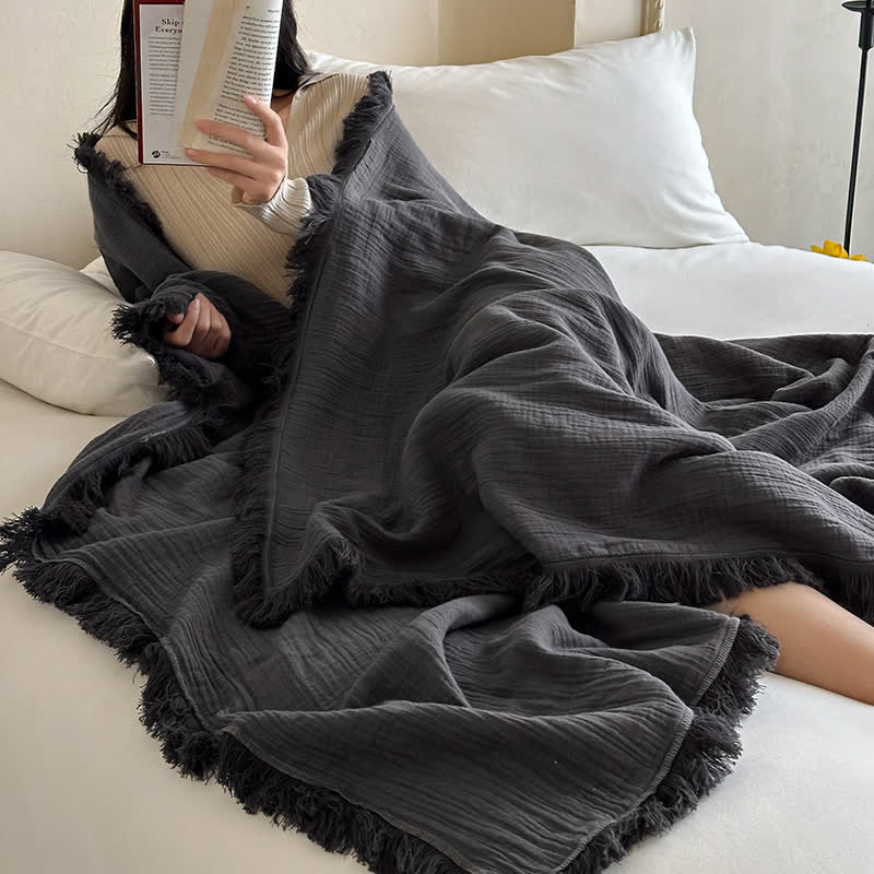 Coperta in garza di cotone con nappe in tinta unita semplice