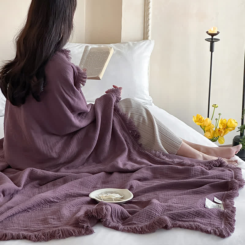 Coperta in garza di cotone con nappe in tinta unita semplice