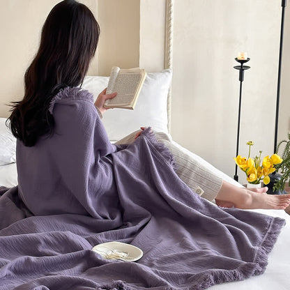 Coperta in garza di cotone con nappe in tinta unita semplice