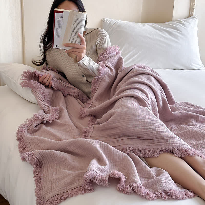 Coperta in garza di cotone con nappe in tinta unita semplice