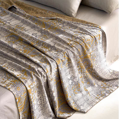 Trapunta morbida e traspirante in fibra di Lyocell con motivo jacquard Paisley