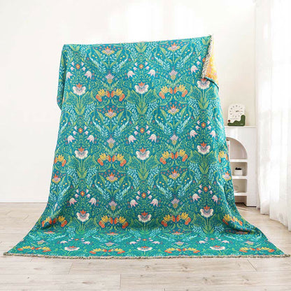 Trapunta reversibile in garza di cotone con nappe a forma di fiore