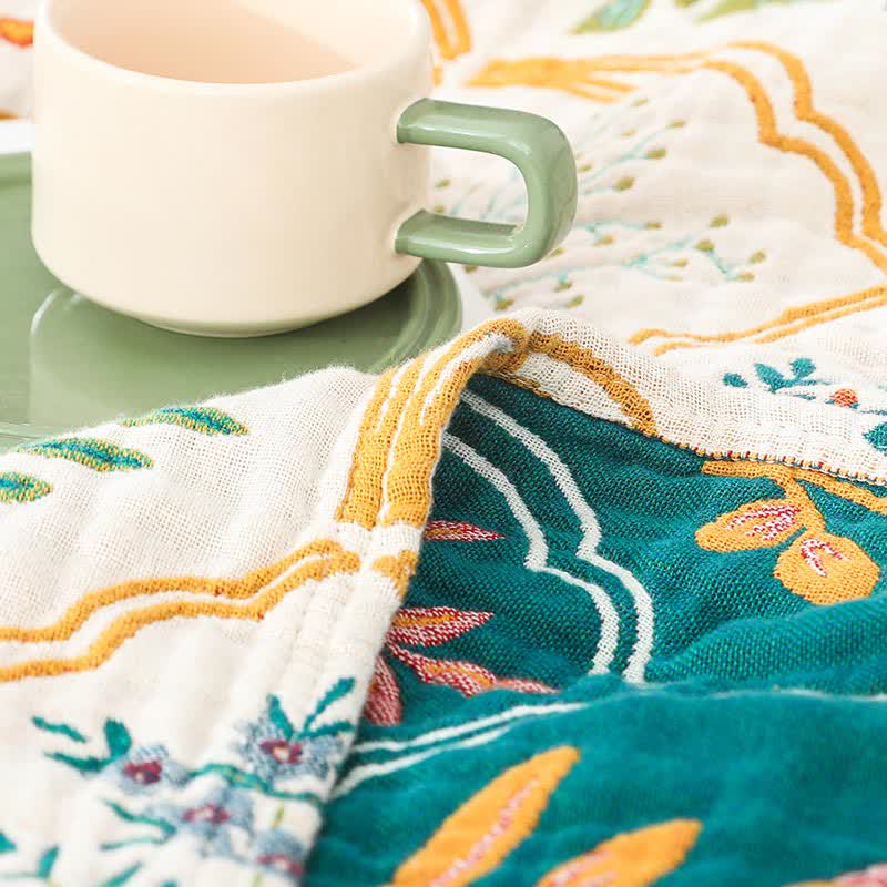 Trapunta reversibile in garza di cotone con motivo floreale a rombi