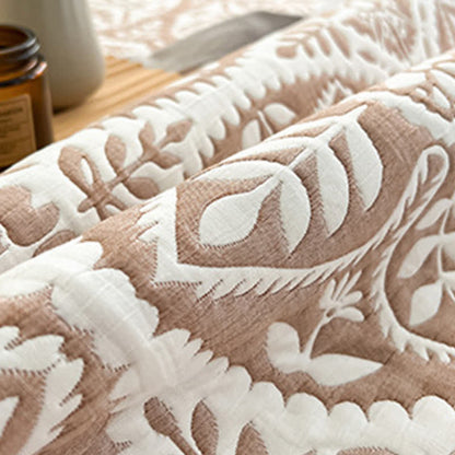 Copriletto jacquard con motivo a foglie geometriche