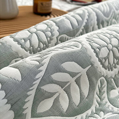 Copriletto jacquard con motivo a foglie geometriche