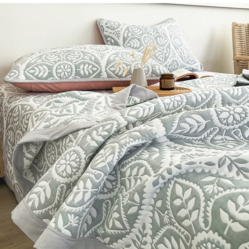 Copriletto jacquard con motivo a foglie geometriche