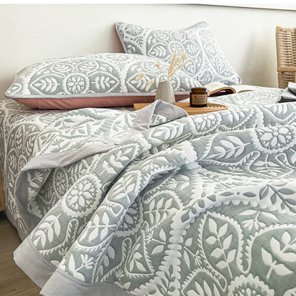 Copriletto jacquard con motivo a foglie geometriche