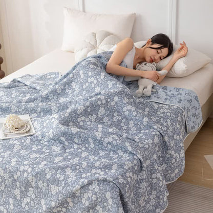 Trapunta reversibile in garza di cotone jacquard floreale