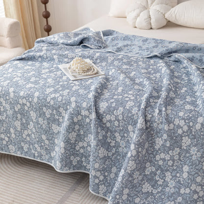 Trapunta reversibile in garza di cotone jacquard floreale