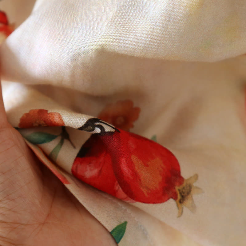Pigiama a maniche corte in cotone con stampa melograno e incrocio sul davanti