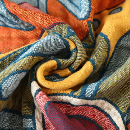 Coperta reversibile con nappe in garza di cotone con motivo floreale artistico