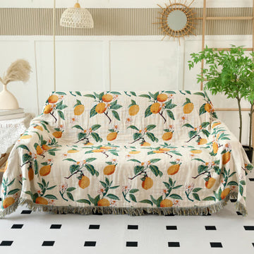 Coperta reversibile in garza di cotone con stampa limone e nappe