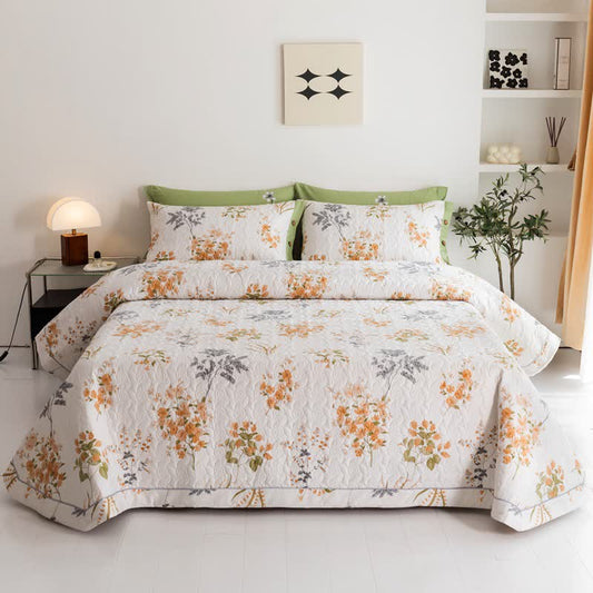 Trapunta in cotone con stampa botanica floreale arancione