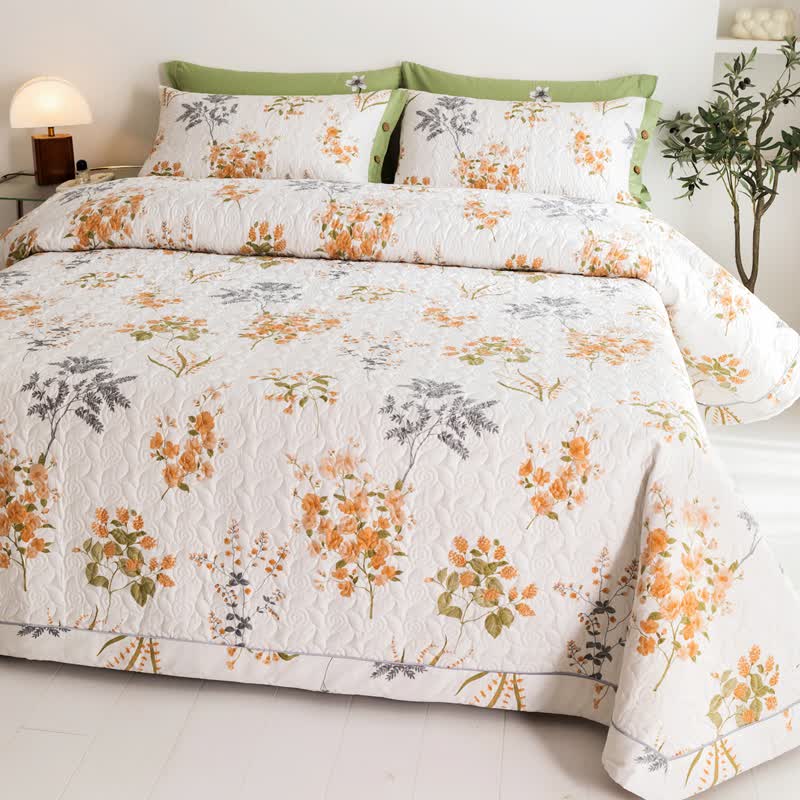 Trapunta in cotone con stampa botanica floreale arancione