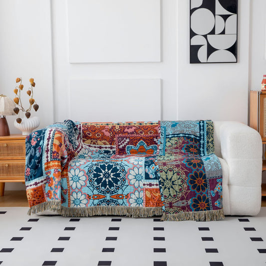 Coperta reversibile in cotone con nappe e motivo floreale blu boho