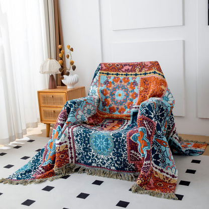 Coperta reversibile in cotone con nappe e motivo floreale blu boho