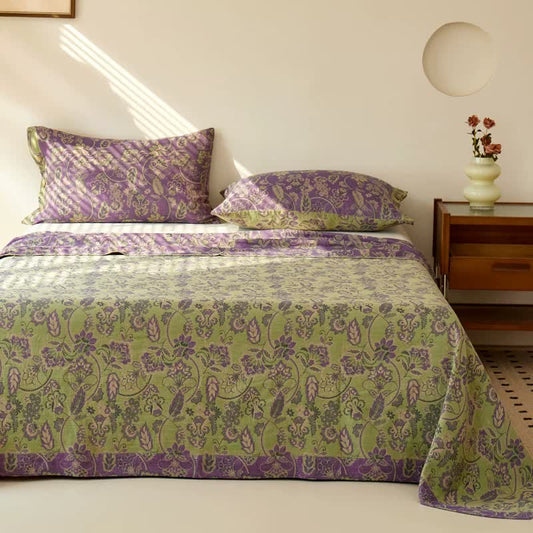 Copriletto in garza di cotone jacquard con motivo floreale astratto