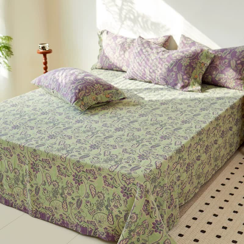 Copriletto in garza di cotone jacquard con motivo floreale astratto