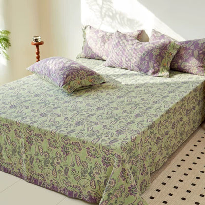 Copriletto in garza di cotone jacquard con motivo floreale astratto
