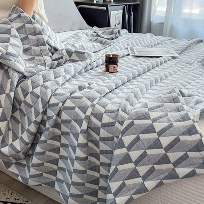 Trapunta in mussola di cotone con stampa geometrica a triangolo