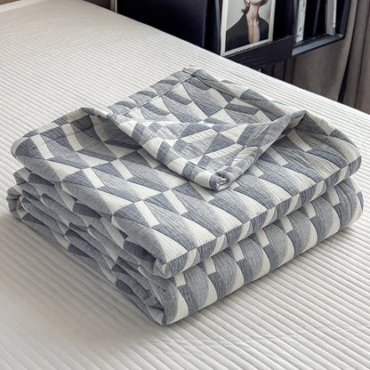 Trapunta in mussola di cotone con stampa geometrica a triangolo