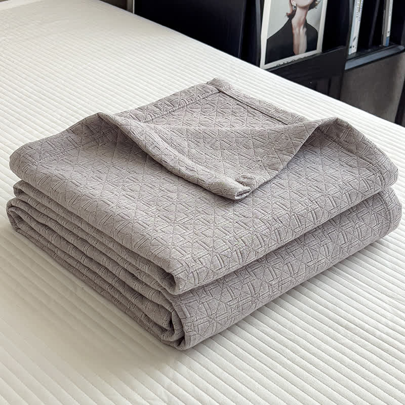 Trapunta in mussola di cotone con stampa a griglia geometrica