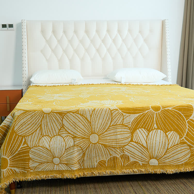 Coperta in ciniglia jacquard con nappe e motivo a margherita