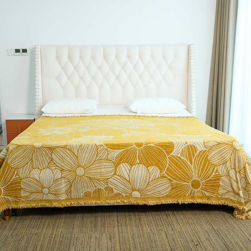 Coperta in ciniglia jacquard con nappe e motivo a margherita