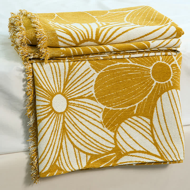 Coperta in ciniglia jacquard con nappe e motivo a margherita