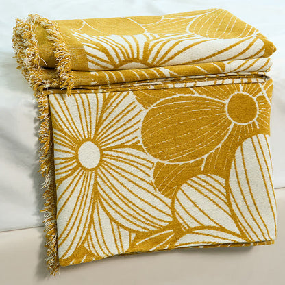 Coperta in ciniglia jacquard con nappe e motivo a margherita
