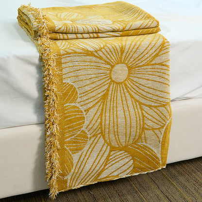 Coperta in ciniglia jacquard con nappe e motivo a margherita