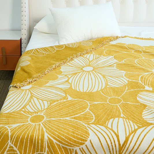 Coperta in ciniglia jacquard con nappe e motivo a margherita