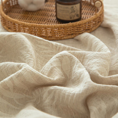 Copriletto in lino e cotone testurizzato beige con motivo botanico