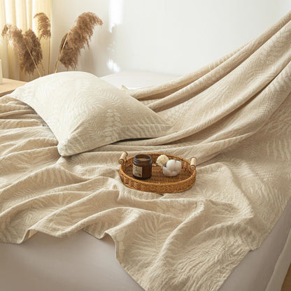 Copriletto in lino e cotone testurizzato beige con motivo botanico