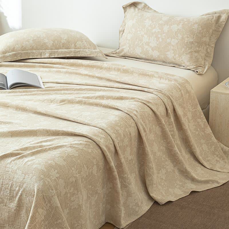 Copriletto in lino e cotone testurizzato con motivo floreale beige