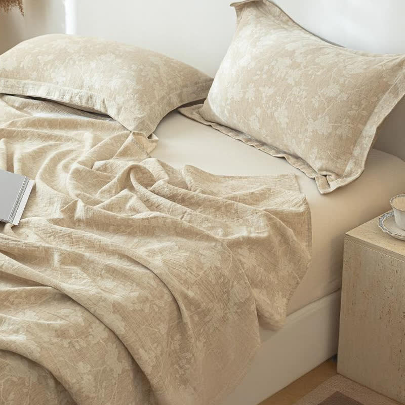 Copriletto in lino e cotone testurizzato con motivo floreale beige