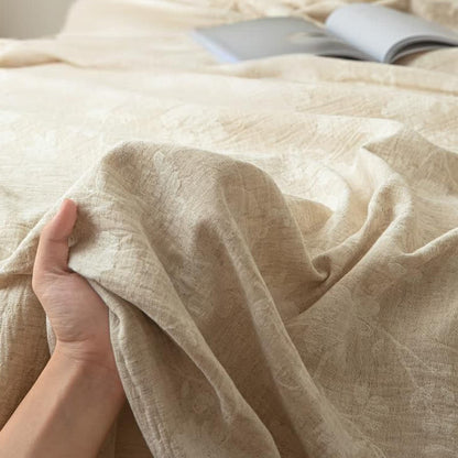 Copriletto in lino e cotone testurizzato con motivo floreale beige